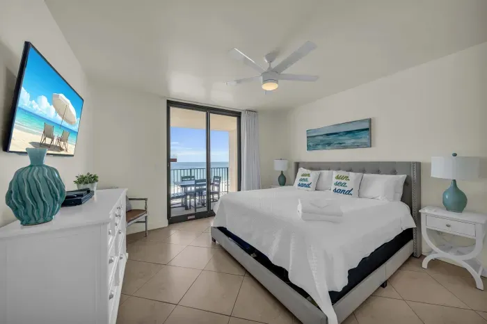 Primary bedroom with balcony access