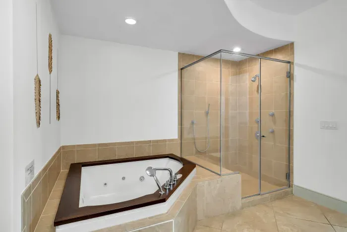 Large walk in shower and garden tub in primary bathroom