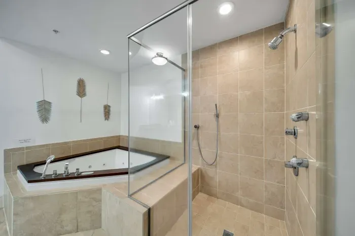 Large walk in shower and garden tub in primary bathroom