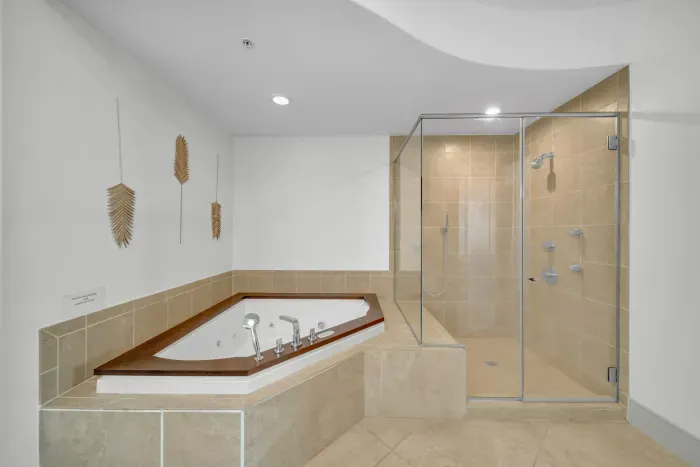Large walk in shower and garden tub in primary bathroom