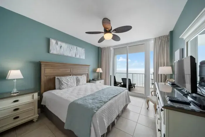 Primary bedroom with balcony access