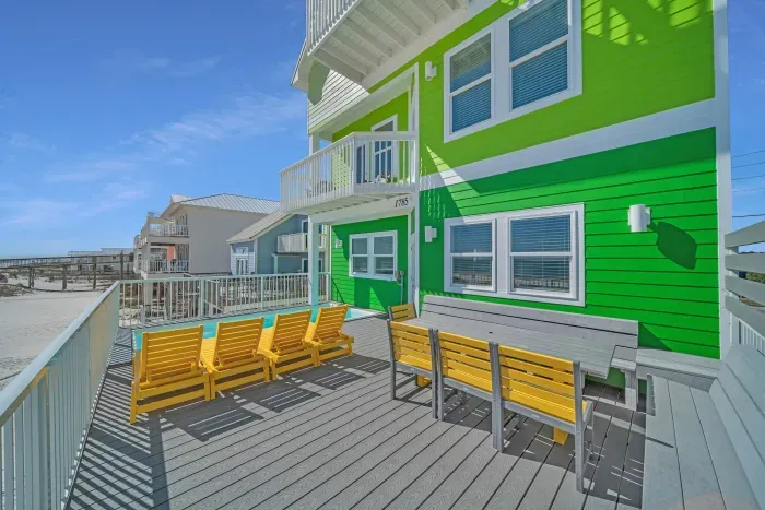 Sun deck with outdoor dining and loungers