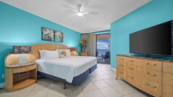 Primary bedroom with balcony access