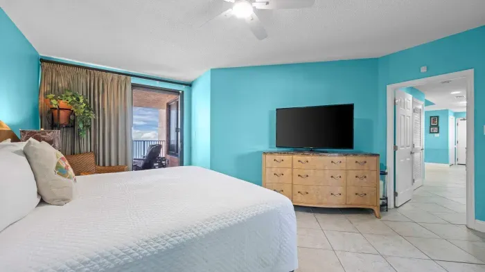 Primary bedroom with balcony access