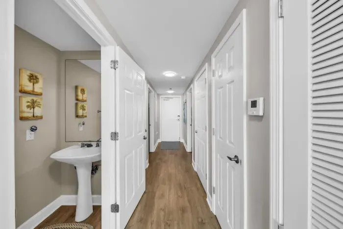 Half bathroom hallway to bedrooms