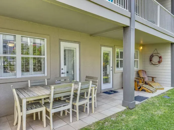 Patio off the primary bedroom with outdoor dining for 6