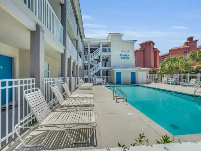 Large pool deck with loungers