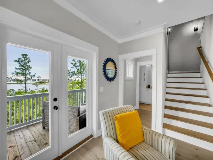 Living room view down hallway into downstairs bathroom