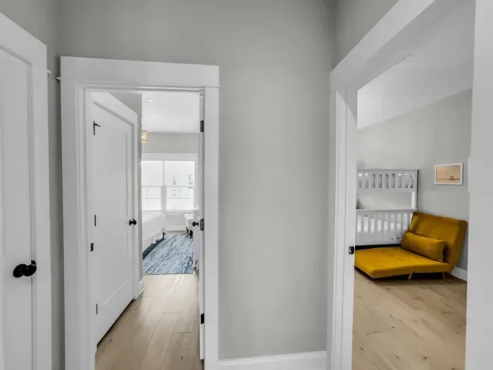 Hallway view looking into primary and 2nd guest bedroom
