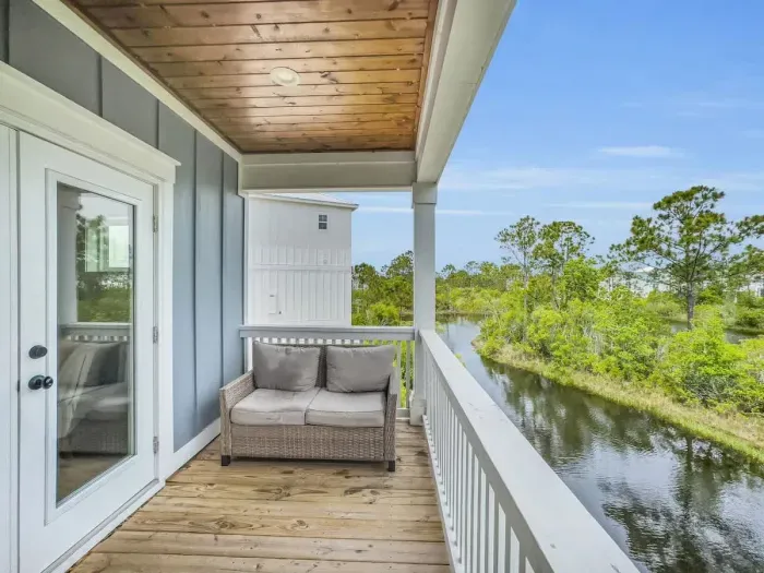 Balcony off living room with views of lake