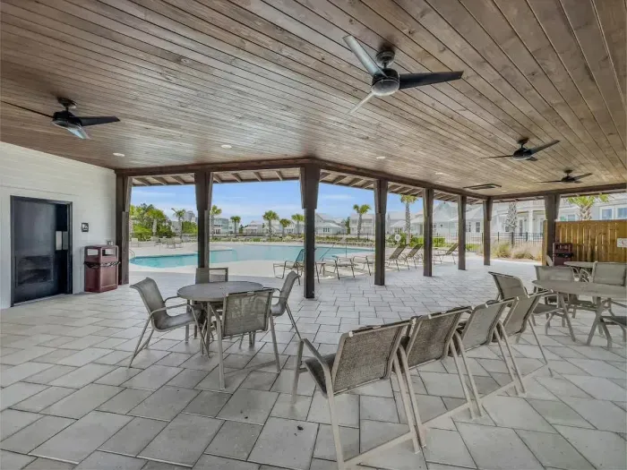 Covered seating area of community pool