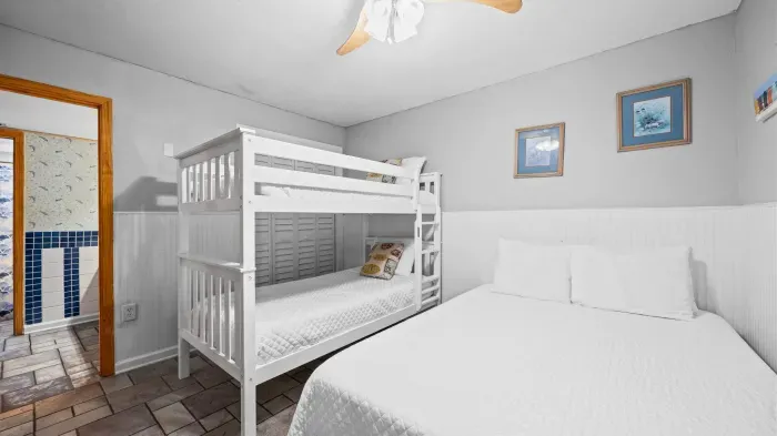 Guest bedroom with full size bed and twin over twin bunk