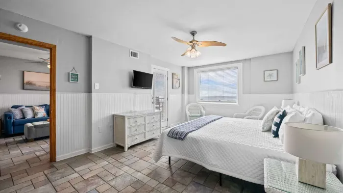 Primary bedroom with access to balcony