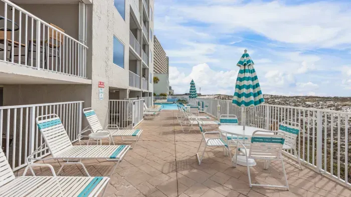 Sun deck with loungers by outdoor pool