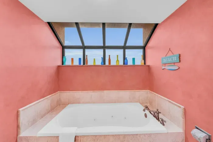 Jetted bathtub in primary bathroom