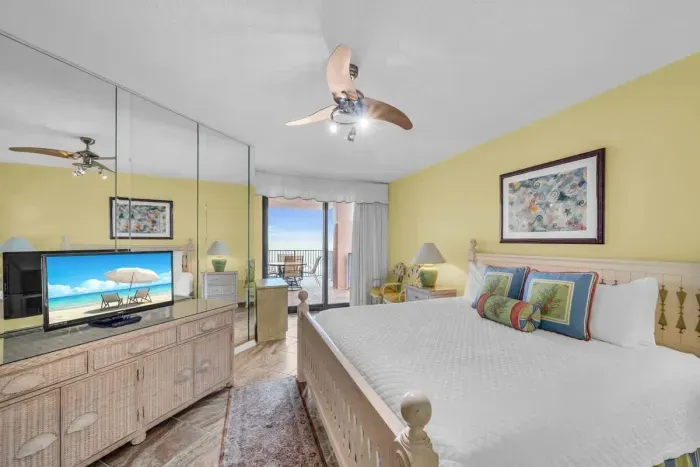 Primary bedroom with balcony access