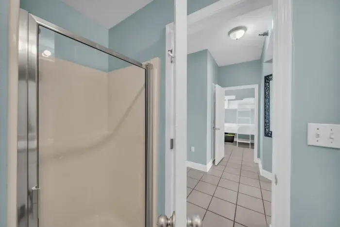 A second full bath in the hallway caters to the Bunk Room and drop-in guests.