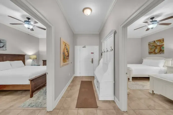 Entry way into the unit with hallway off guest bedrooms