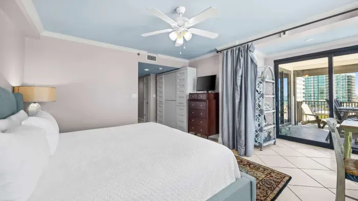 Primary bedroom with balcony access