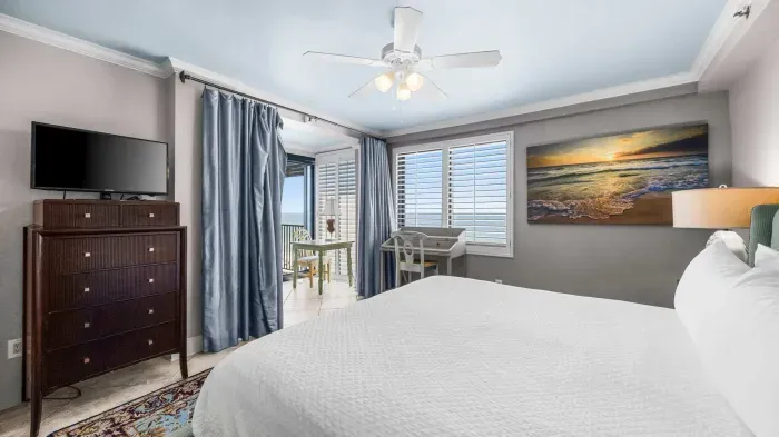 Primary bedroom with balcony access