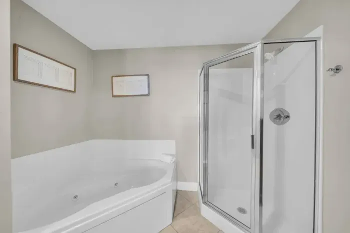 Jacuzzi Tub and Glass Shower in Private Bath