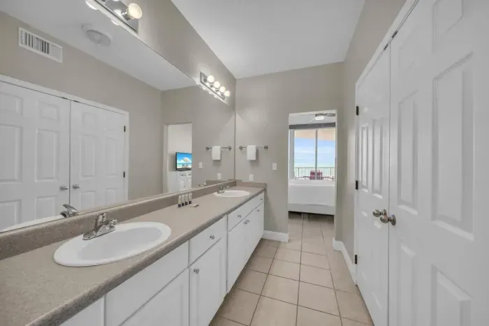 Dual Vanity in dressing area connecting to full private bath