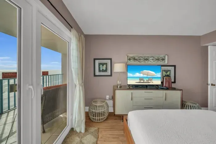 Primary bedroom with balcony access