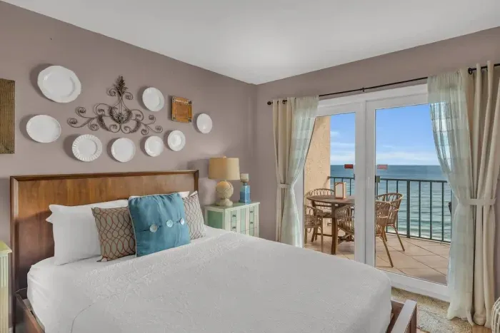 Primary bedroom with balcony access