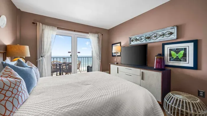 Primary bedroom with balcony access