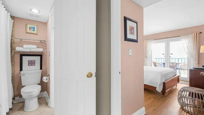 Hallway with access to bathroom