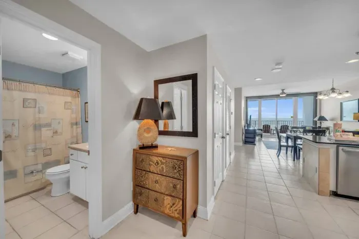 The Entryway and doors opening both to the bedroom and the hallway.