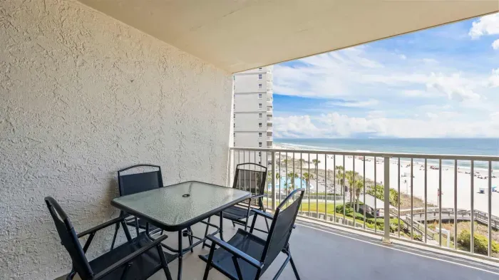 Balcony with dining area off living room