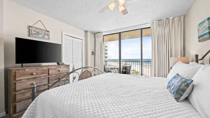 Primary bedroom with balcony access