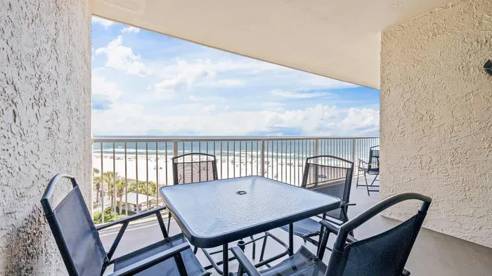 Balcony with dining area off living room