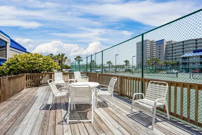 Sun deck overlooking tennis courts