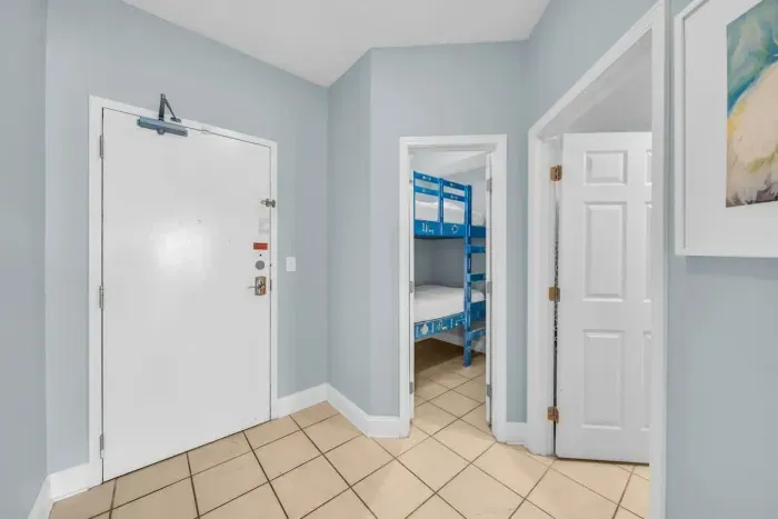 Entry way door to unit looking into bunk room