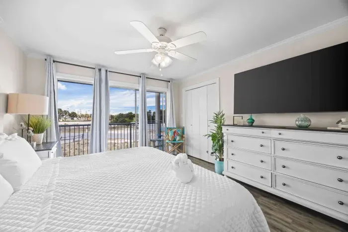 Primary bedroom with balcony access