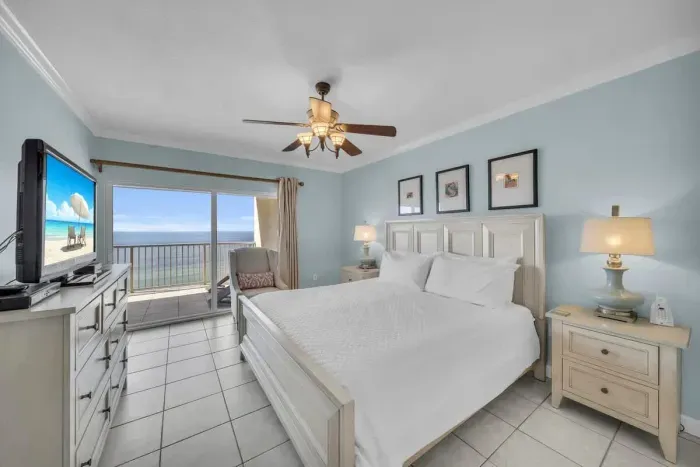 Primary bedroom with balcony access