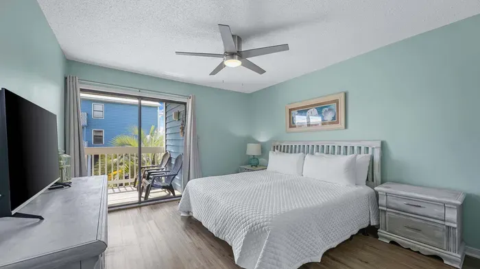 Primary bedroom with balcony access