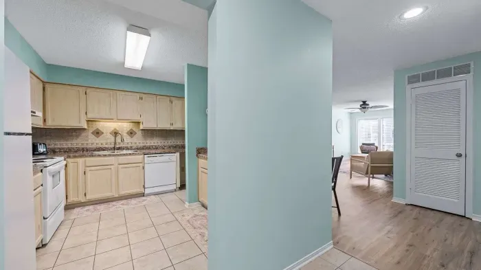 Kitchen hallway wraps around to dining area
