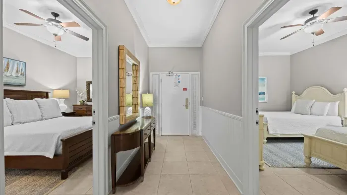 View of entry way to unit and hall looking into the guest bedrooms
