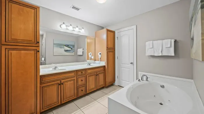 Primary bathroom with duel vanity and garden tub