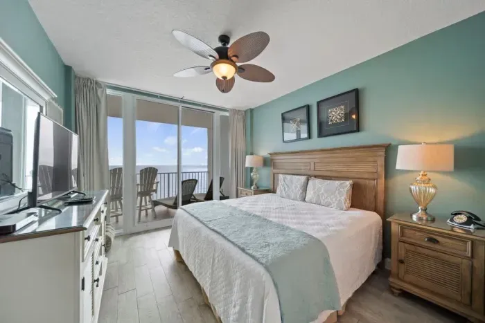 Primary bedroom with balcony access