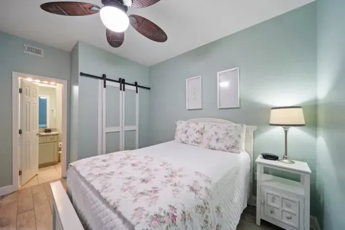 Guest bedroom with full size bed and a twin trundle bed