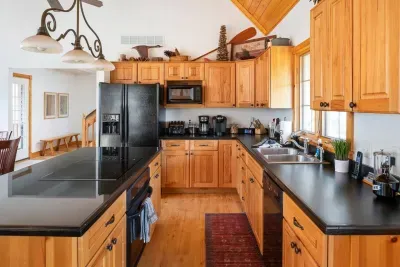 Spacious Kitchen: Cook up memories surrounded by warm wood tones and modern appliances!