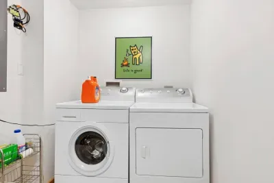 Laundry Room: Enjoy the convenience of in-house laundry with a bright, cheerful vibe!