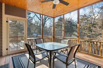 Screened Porch: Enjoy morning coffee with stunning forest views and a refreshing breeze!