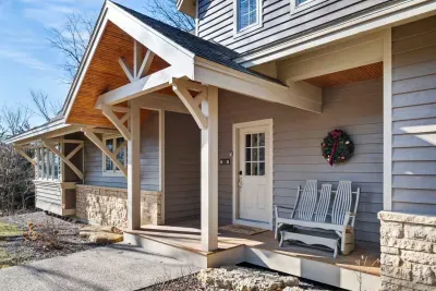 Grand Exterior Entrance: Enjoy the charm of this inviting porch, perfect for relaxing in nature's embrace!