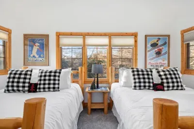 Twin (Queen) Bedroom: Relax in style with vintage decor and bright windows for the perfect getaway!