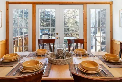 Dining Room: Dine with style as sunlight streams through, overlooking nature's serene beauty!